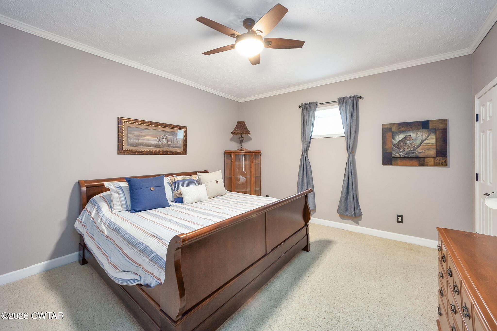 16 Fields Chase Jackson, TN 38305 - Photo 39 of 47 a bedroom with a bed and a chandelier