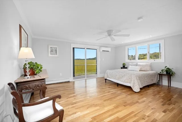 a bathroom with a toilet a sink and a window