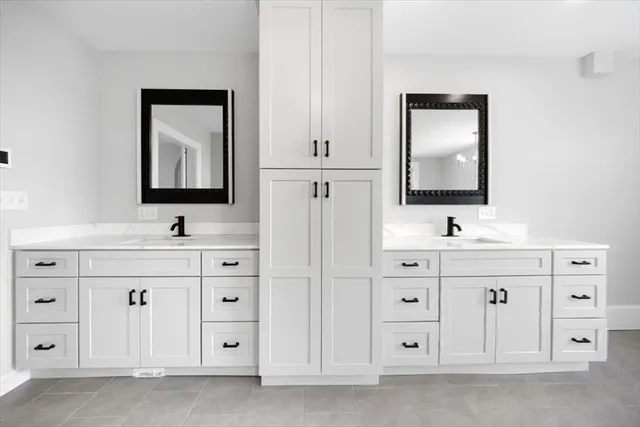 a bedroom with furniture and a wooden floor