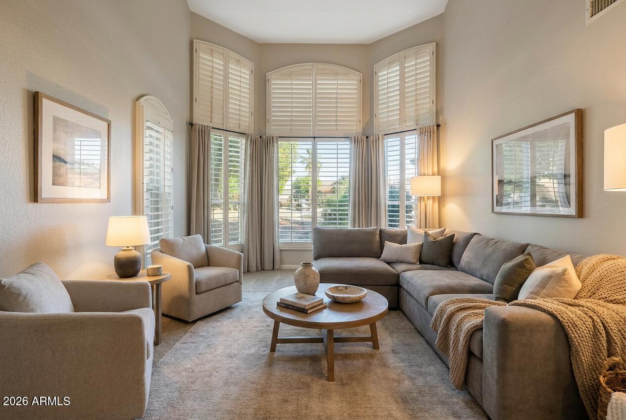 17002 South 34th Place Phoenix, AZ 85048 - Photo 12 of 27 a living room with furniture and a large window