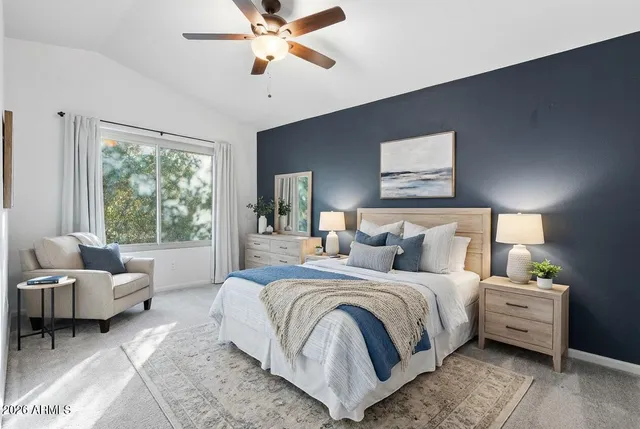 a bedroom with bed and a window