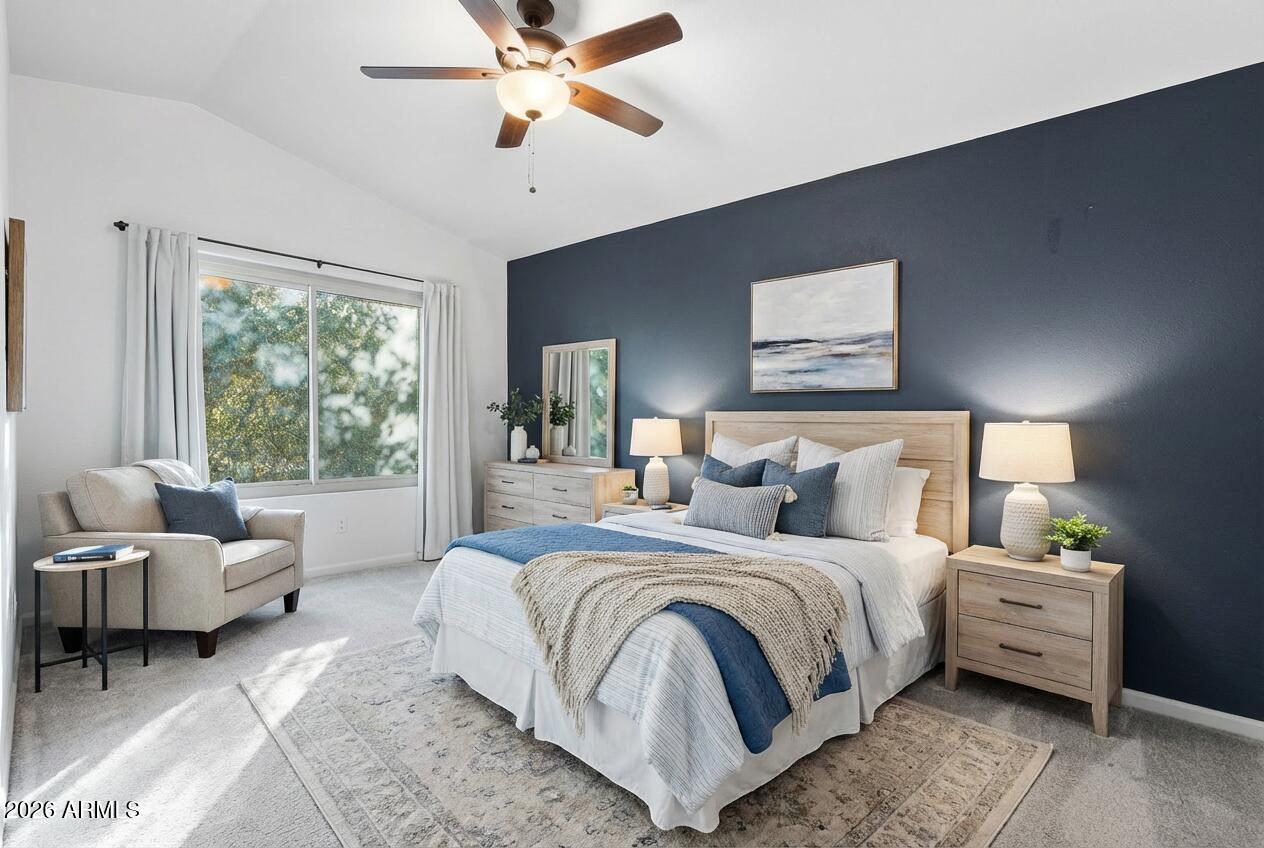 17002 South 34th Place Phoenix, AZ 85048 - Photo 16 of 27 a bedroom with a bed and a chandelier