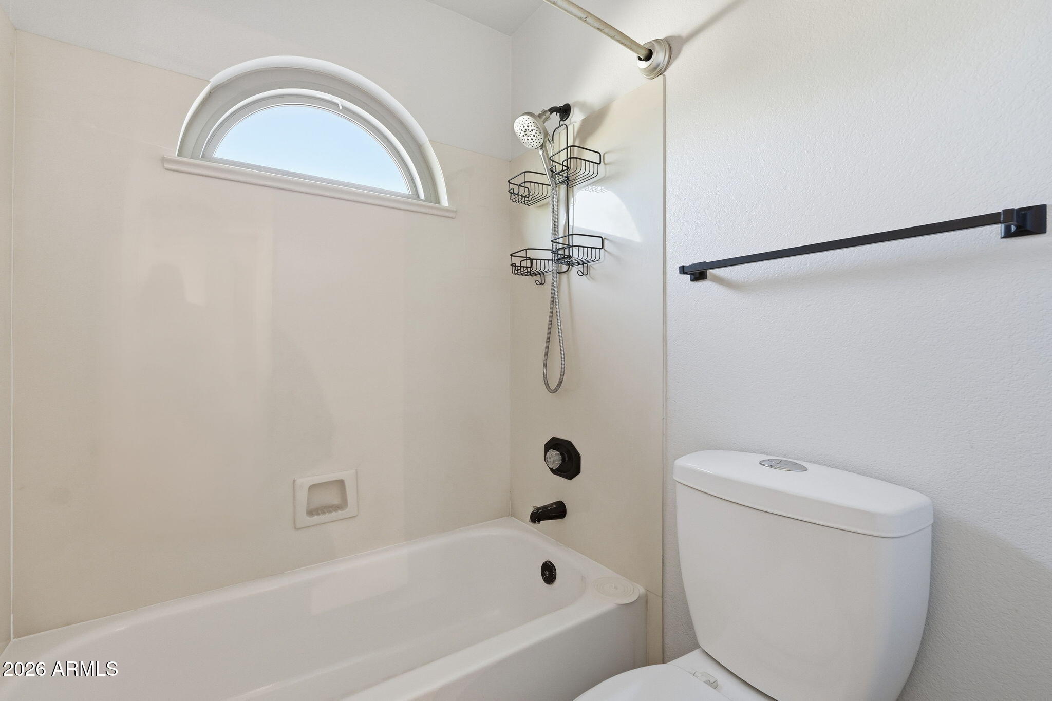 17002 South 34th Place Phoenix, AZ 85048 - Photo 19 of 27 a bathroom with a toilet and a bathtub