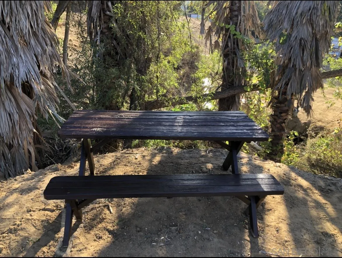 Lilac Road Bonsall, CA 92003 - Photo 12 of 15 a view of a wooden bench in the backyard
