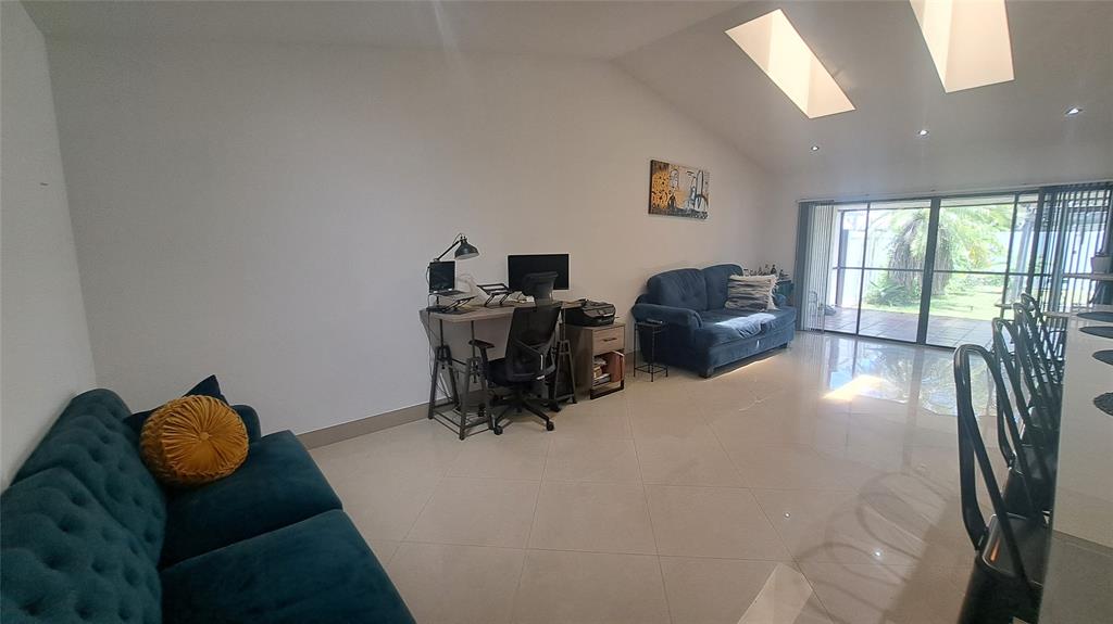 4519 Feivel Road, Unit 46 West Palm Beach, FL 33417 - Photo 15 of 56 a room with furniture and a large window