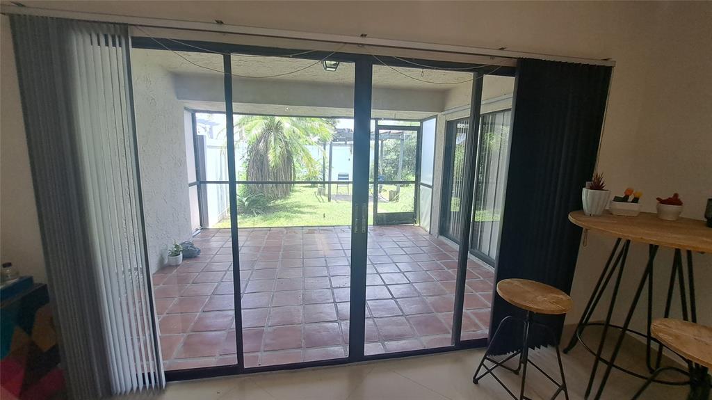 4519 Feivel Road, Unit 46 West Palm Beach, FL 33417 - Photo 17 of 56 a bathroom with a glass door shower and a table