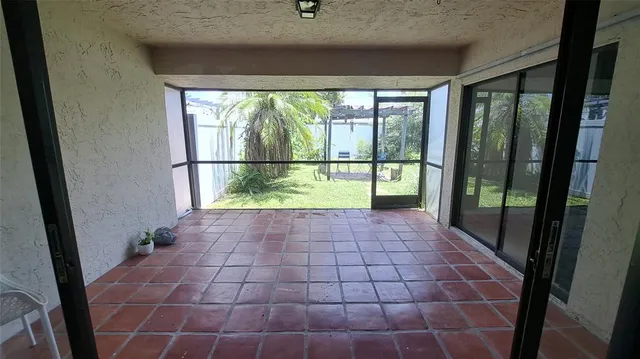 a bedroom with a bed rug and window