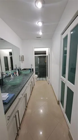 a view of gym equipment and floor to ceiling window