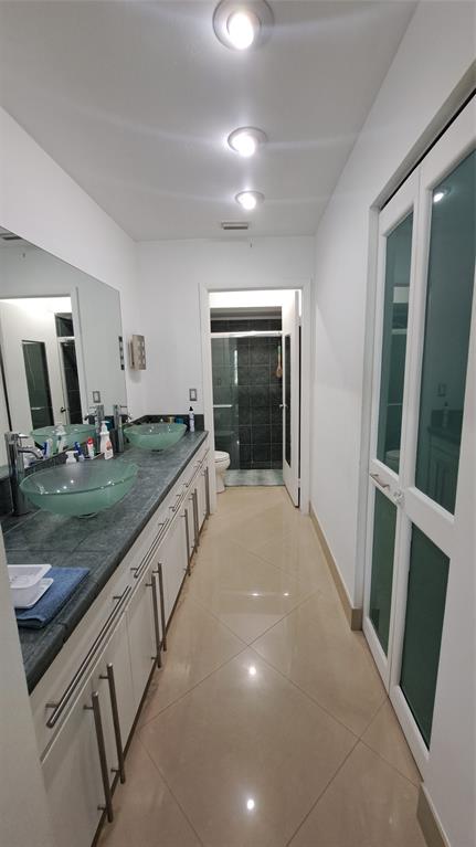 4519 Feivel Road, Unit 46 West Palm Beach, FL 33417 - Photo 24 of 56 a bathroom with sink and mirror