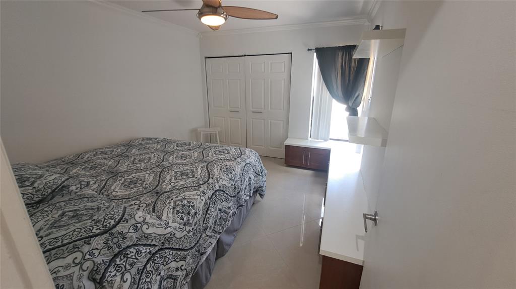 4519 Feivel Road, Unit 46 West Palm Beach, FL 33417 - Photo 31 of 56 a bedroom with a bed and a window