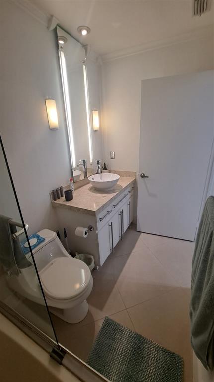 4519 Feivel Road, Unit 46 West Palm Beach, FL 33417 - Photo 40 of 56 a spacious bathroom with a double vanity sink and a mirror