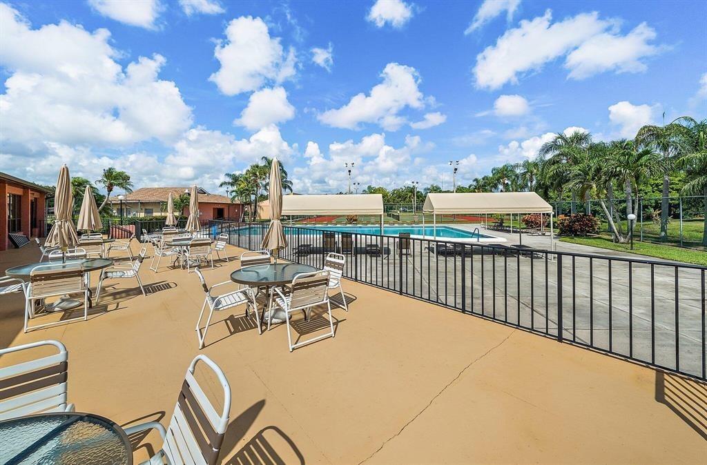 4519 Feivel Road, Unit 46 West Palm Beach, FL 33417 - Photo 52 of 56 a view of a terrace with furniture