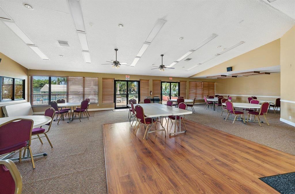 4519 Feivel Road, Unit 46 West Palm Beach, FL 33417 - Photo 54 of 56 a living room with lots of furniture and a large window