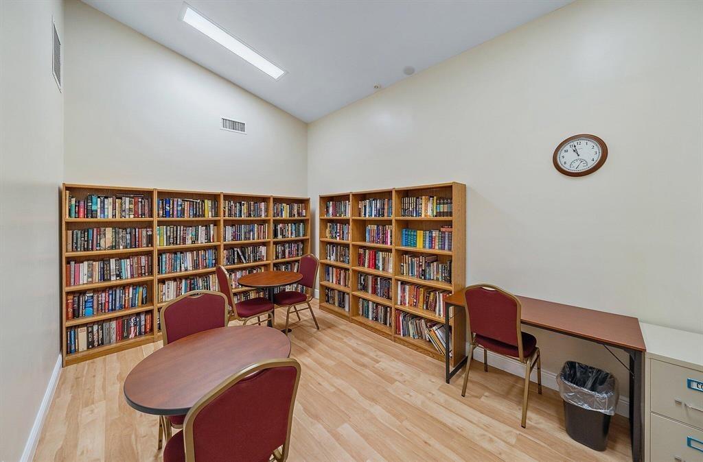 4519 Feivel Road, Unit 46 West Palm Beach, FL 33417 - Photo 55 of 56 a view of a workspace with furniture and bookshelf