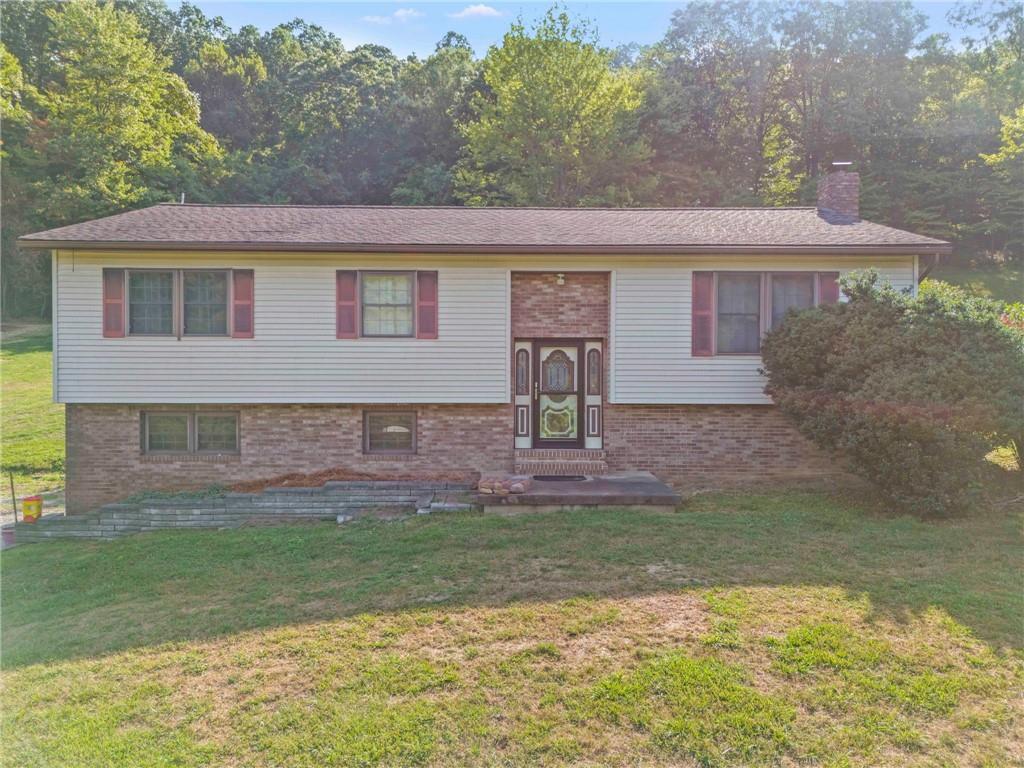 218 Gwynn Road Jefferson, PA 15344 - Photo 1 of 32 a front view of a house with a yard