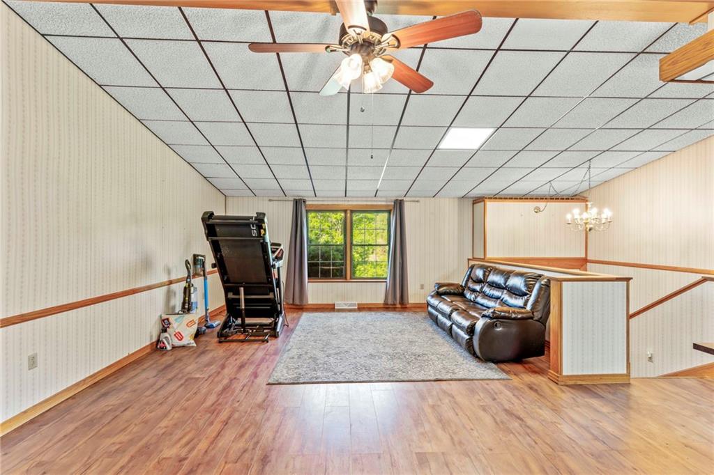 218 Gwynn Road Jefferson, PA 15344 - Photo 15 of 32 a view of a room with gym equipment and wooden floor