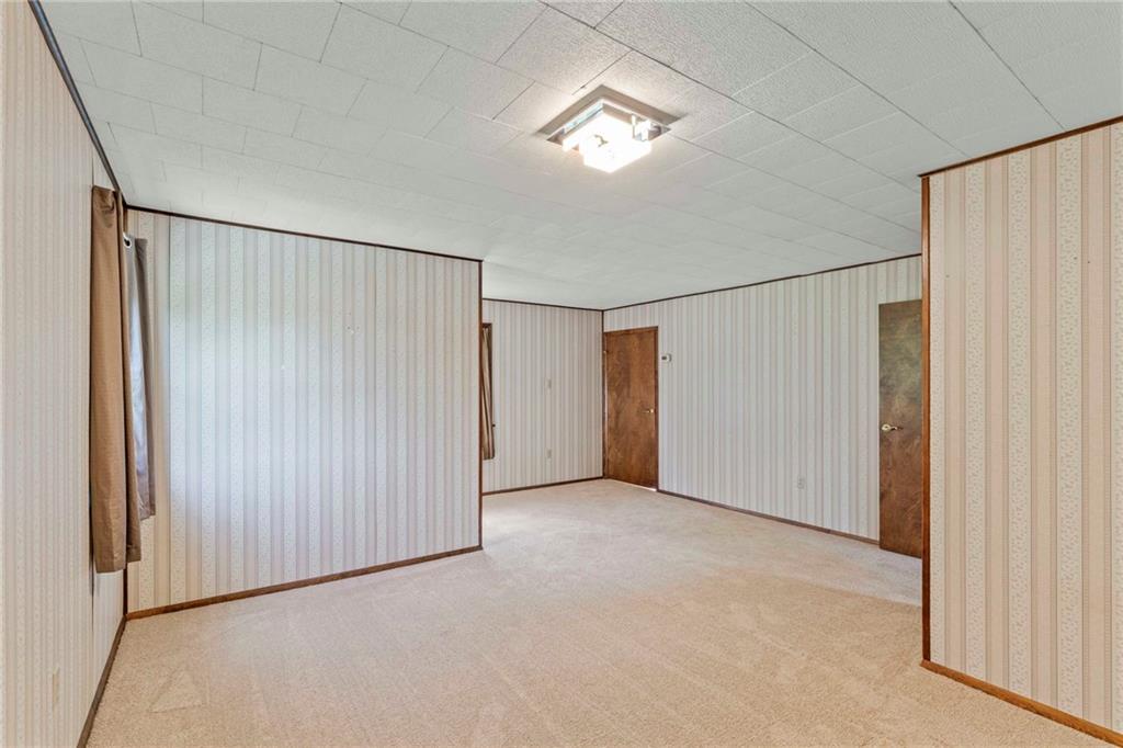 218 Gwynn Road Jefferson, PA 15344 - Photo 25 of 32 wooden floor in an empty room