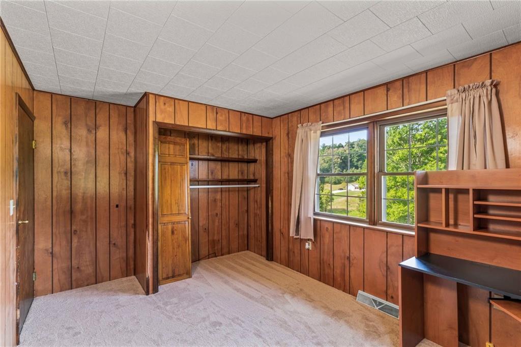 218 Gwynn Road Jefferson, PA 15344 - Photo 30 of 32 a bedroom with a bed and a window