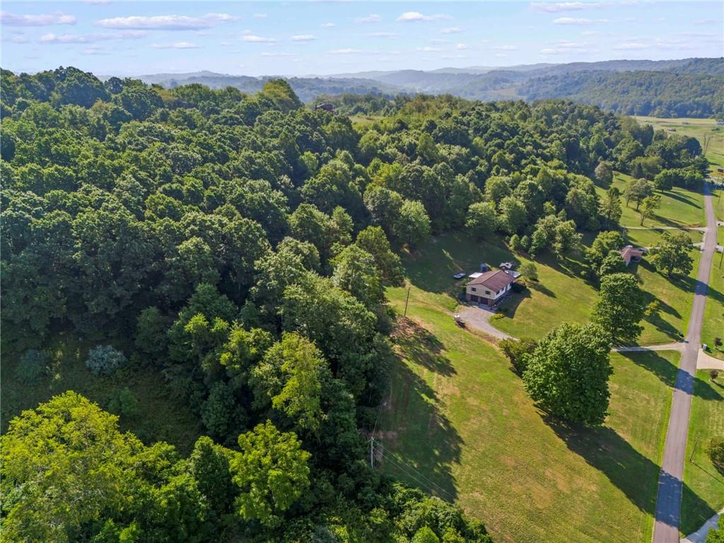 218 Gwynn Road Jefferson, PA 15344 - Photo 4 of 32 a view of a lake with a house