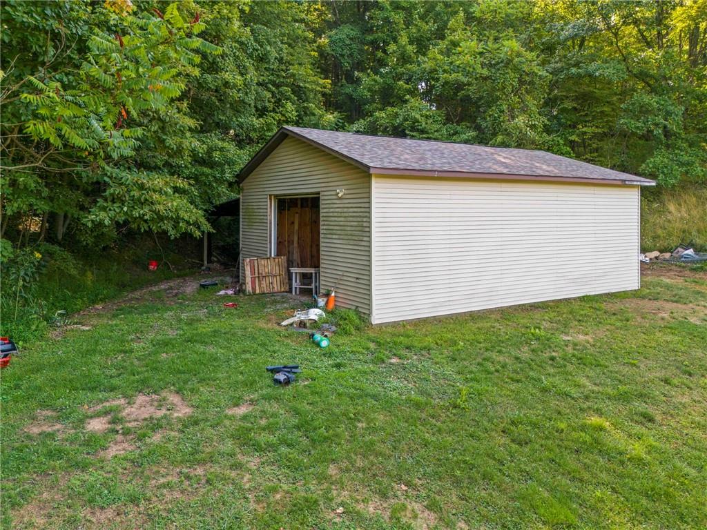 218 Gwynn Road Jefferson, PA 15344 - Photo 6 of 32 a backyard of a house with plants and large tree
