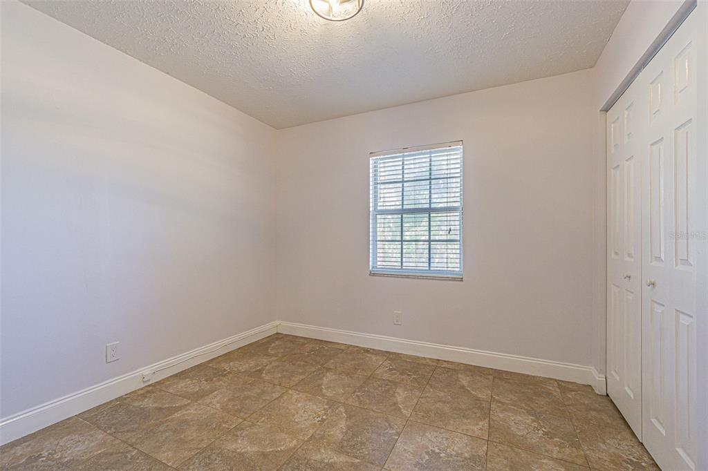 3801 Durant Road Valrico, FL 33596 - Photo 20 of 56 an empty room with a window