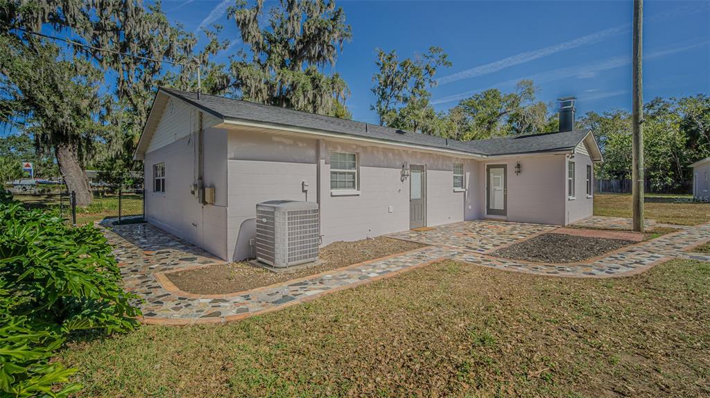 3801 Durant Road Valrico, FL 33596 - Photo 37 of 56 a view of a house with a yard