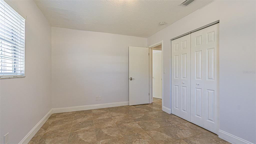 3801 Durant Road Valrico, FL 33596 - Photo 46 of 56 an empty room with windows