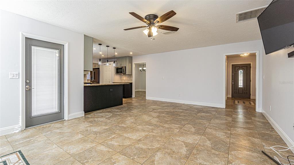 3801 Durant Road Valrico, FL 33596 - Photo 47 of 56 a view of an empty room with a kitchen