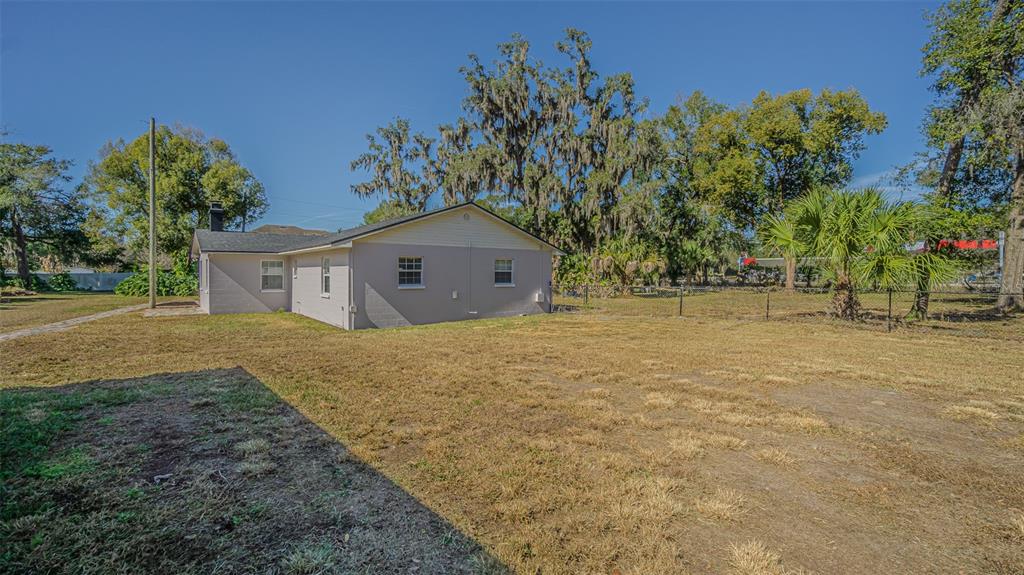 3801 Durant Road Valrico, FL 33596 - Photo 53 of 56 a house with trees in front of it
