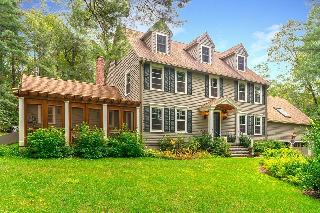95 Pine Street Medfield, MA 02052 - Photo 1 of 30 a front view of a house with a yard and trees
