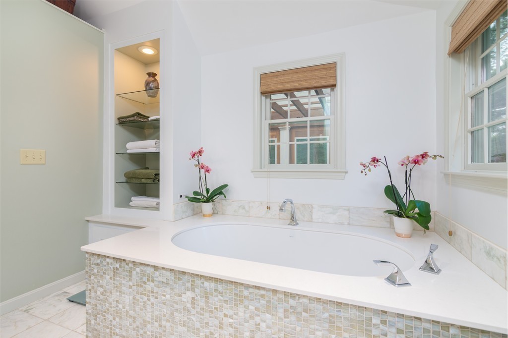 95 Pine Street Medfield, MA 02052 - Photo 13 of 30 a bathroom with a tub sink and a window