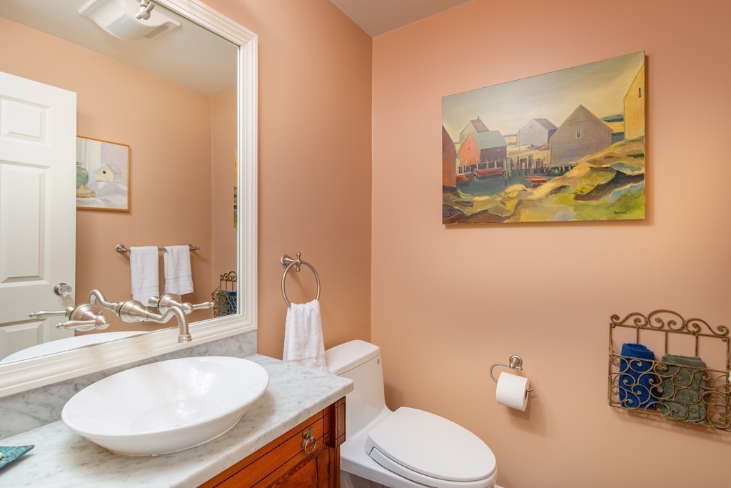 95 Pine Street Medfield, MA 02052 - Photo 17 of 30 a bathroom with a toilet a sink and mirror
