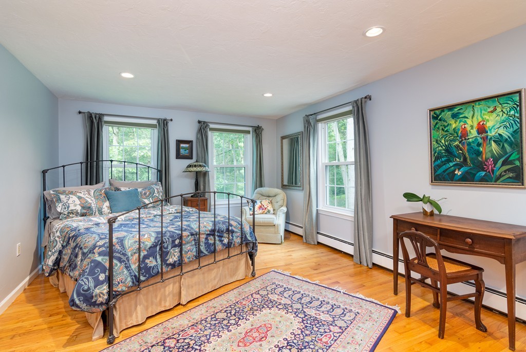 95 Pine Street Medfield, MA 02052 - Photo 18 of 30 a bedroom with a bed and large windows
