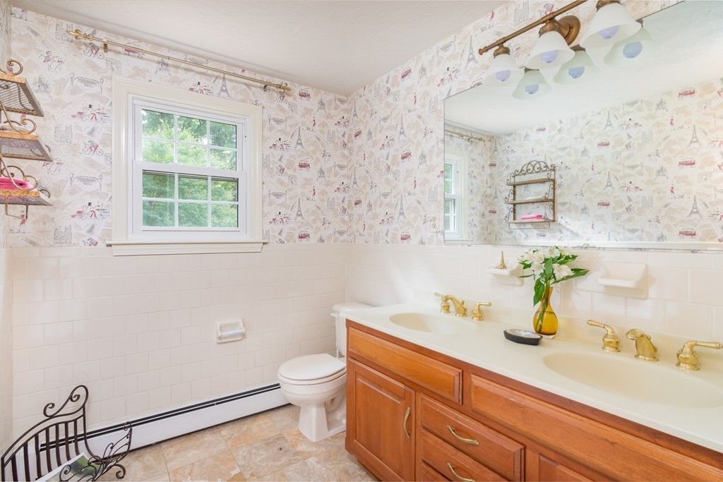 95 Pine Street Medfield, MA 02052 - Photo 19 of 30 a bathroom with a sink a mirror and a window