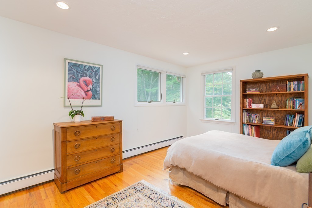 95 Pine Street Medfield, MA 02052 - Photo 20 of 30 a bedroom with a bed and a dresser in it