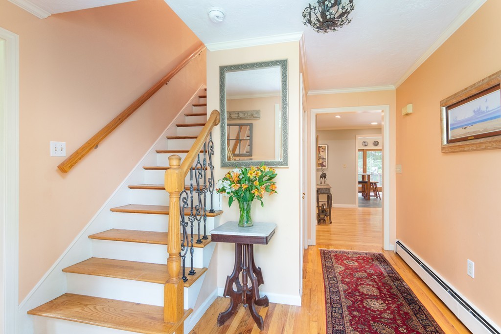 95 Pine Street Medfield, MA 02052 - Photo 2 of 30 a view of entryway with wooden floor and stairs
