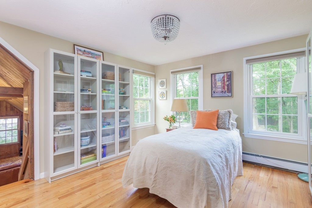 95 Pine Street Medfield, MA 02052 - Photo 21 of 30 a bed sitting in a bedroom next to a window