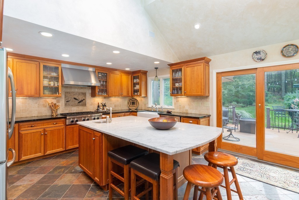 95 Pine Street Medfield, MA 02052 - Photo 7 of 30 a kitchen with stainless steel appliances granite countertop a stove a sink and a refrigerator