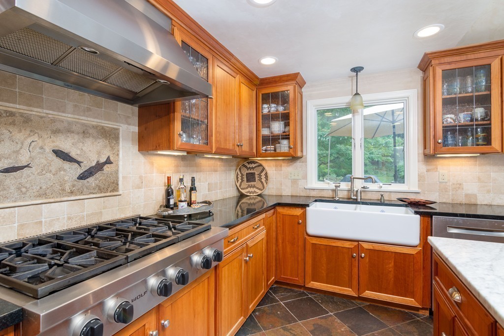 95 Pine Street Medfield, MA 02052 - Photo 8 of 30 a large kitchen with stainless steel appliances a stove sink and cabinets