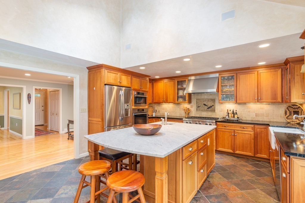 95 Pine Street Medfield, MA 02052 - Photo 9 of 30 a kitchen with a sink a counter top space and stainless steel appliances