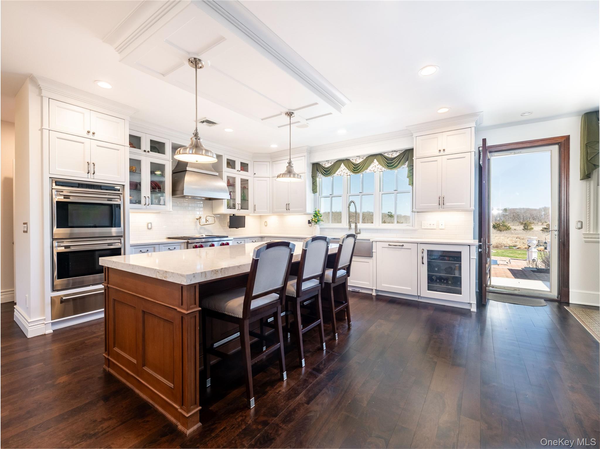 27 True Harbour Way West Islip, NY 11795 - Photo 14 of 26 a large kitchen with a table and chairs