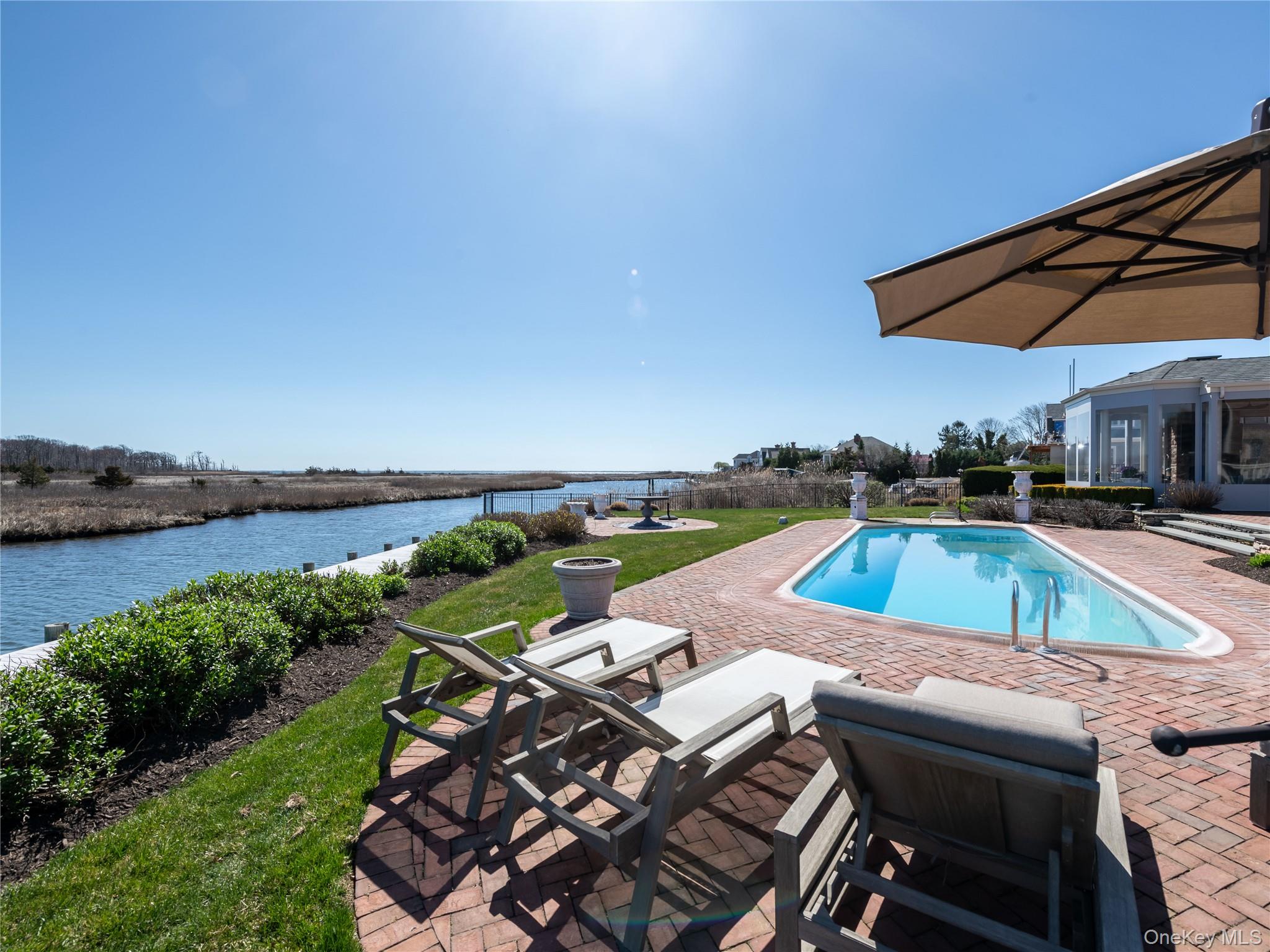 27 True Harbour Way West Islip, NY 11795 - Photo 22 of 26 an aerial view of a house with swimming pool and patio