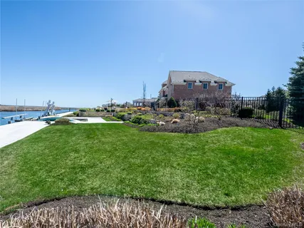 a view of a garden with lawn chairs