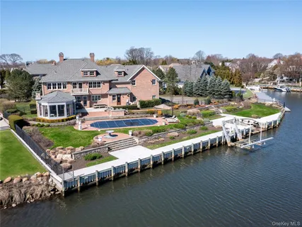 an aerial view of a house with a ocean view