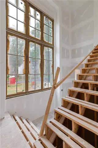 a view of an empty room with windows