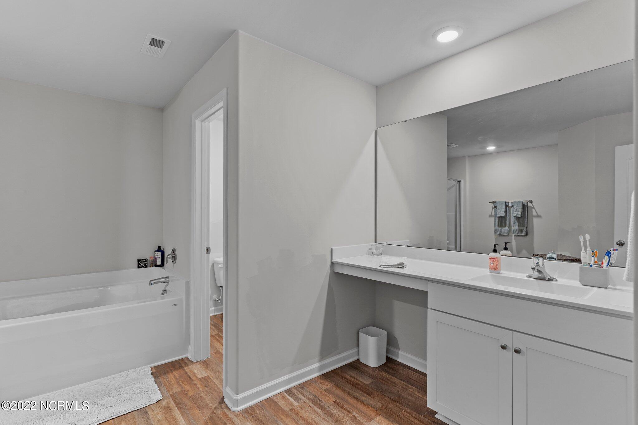 680 Aurora Place Hampstead, NC 28443 - Photo 20 of 35 Primary Bathroom