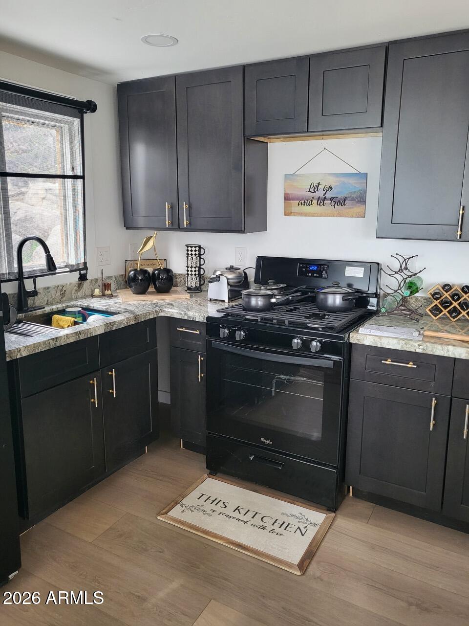 1925 Rock Castle Drive Prescott, AZ 86305 - Photo 8 of 25 a kitchen with a sink stove top oven and cabinets