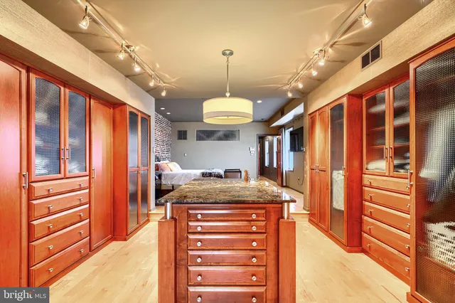 a hallway with a stove and a chandelier
