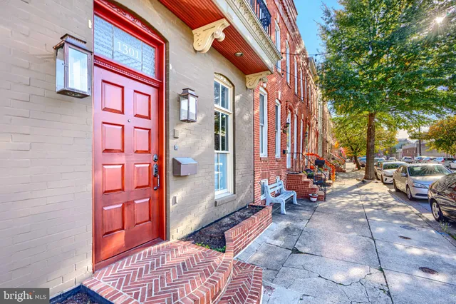a view of a brick building with many windows