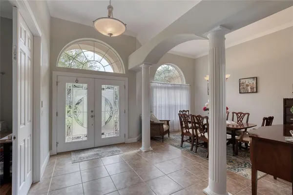 a spacious bedroom with a bed and a couch